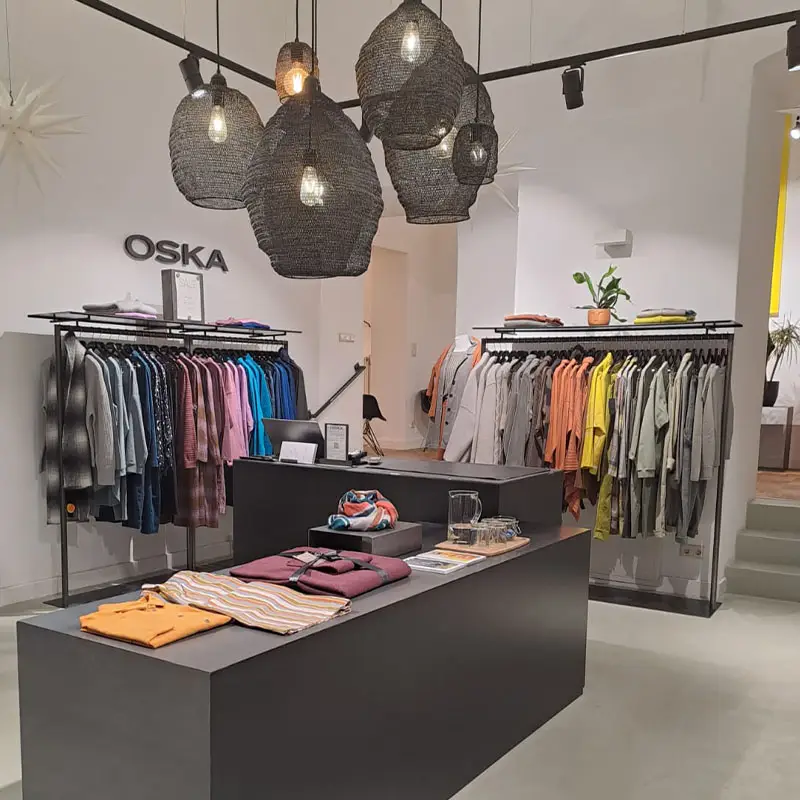 Modern clothing store with vibrant apparel display.