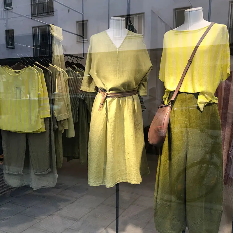 Display of stylish green and yellow clothing.
