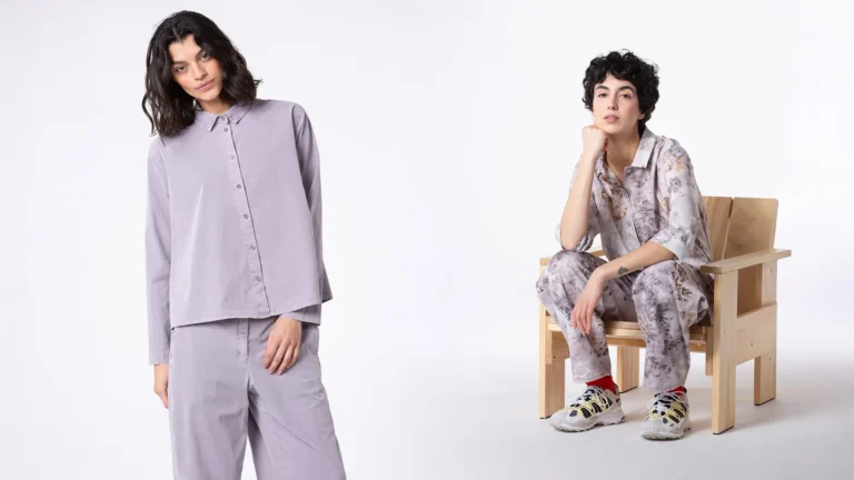 Two women modeling stylish outfits in a minimalist setting.