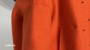 Close-up of an orange wool coat