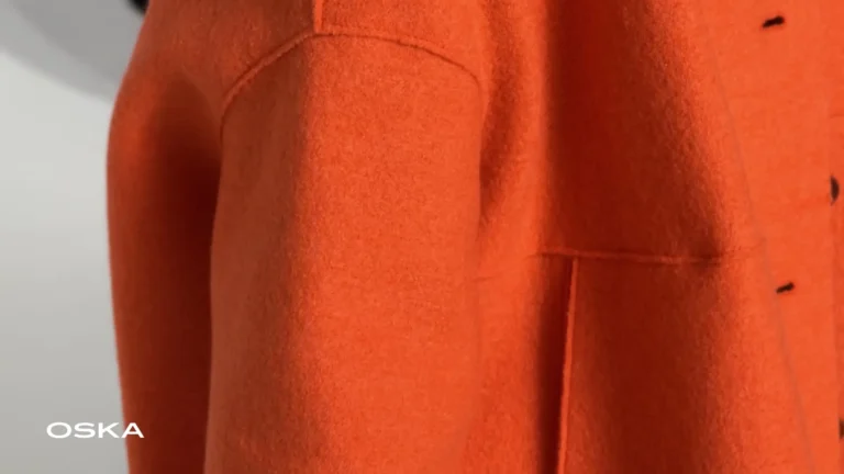 Close-up of an orange wool coat